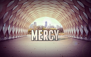 tunnel with mercy text overlay, typography, cityscape