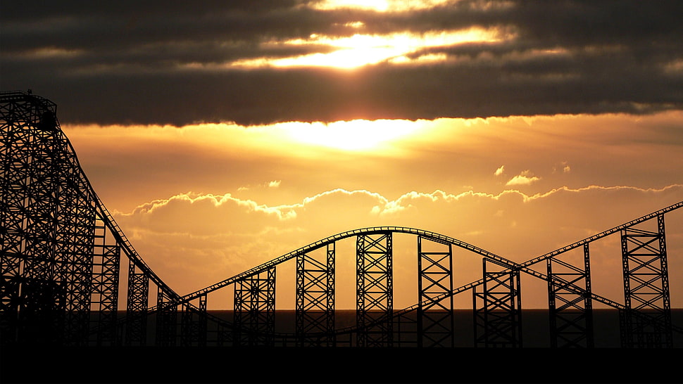 black roller coaster, UK, rollercoasters, sunlight, sunset HD wallpaper