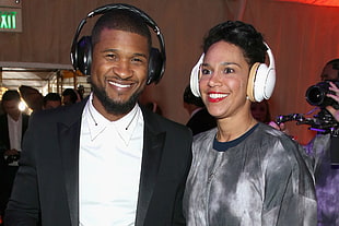 Usher standing beside woman
