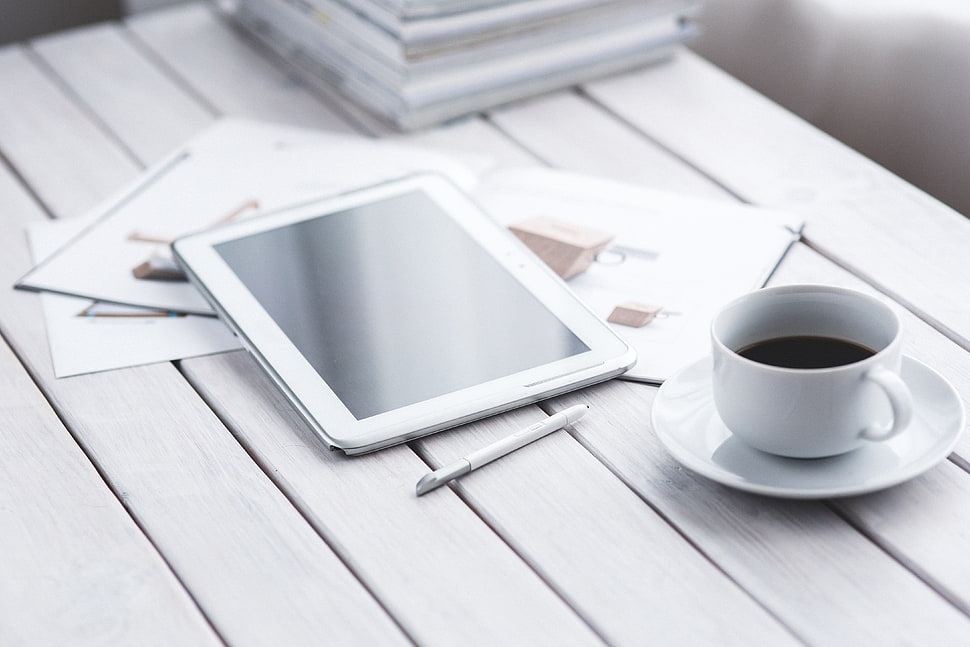 white tablet computer on brown table HD wallpaper
