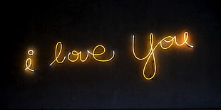 yellow i love you text on black background