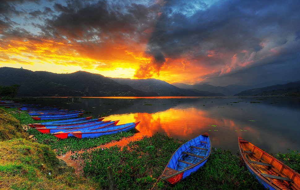 landscape photography of canoes near lake during sunset, phewa lake, pokhara, nepal HD wallpaper