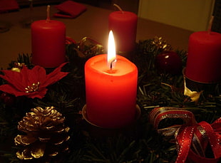 four red Pillar candles