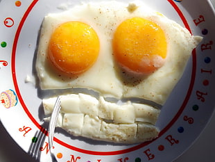 sunny side egg on white ceramic plate