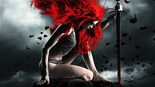 woman with red hair holding sword