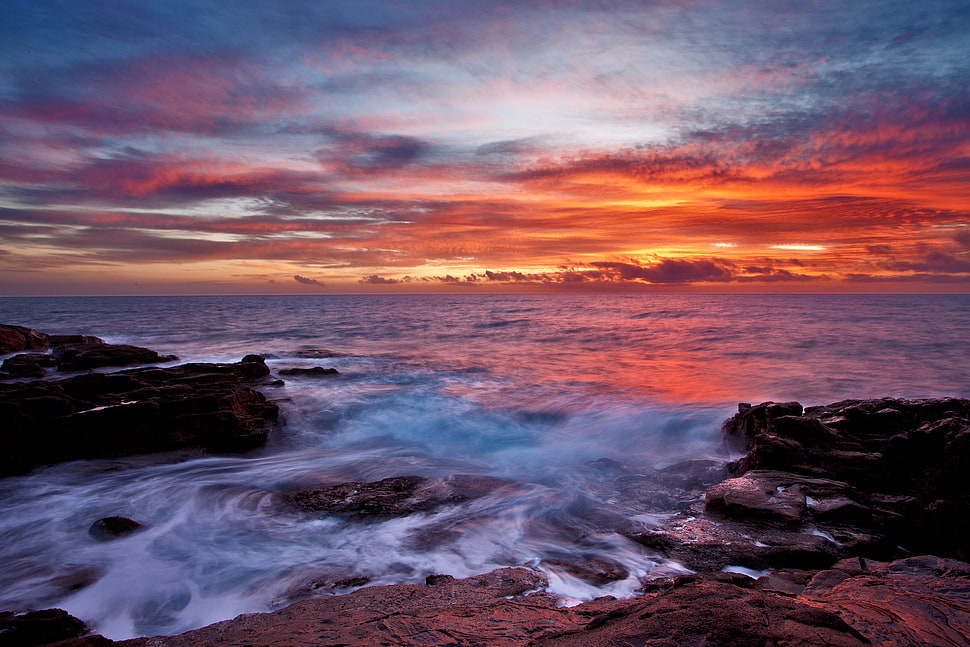 cloudy orange sky over sea HD wallpaper