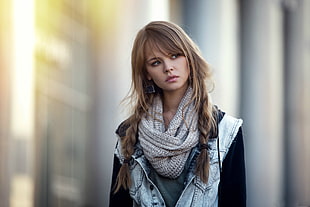 selective focus photography of woman wearing scarf and denim jacket