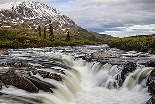 timelapse photography of river near snowy mountain during daytime HD wallpaper