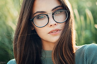 woman wearing black-frame eyeglasses
