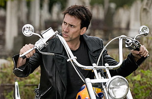 Nicholas Cage riding on a chopper motorcycle