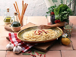 spaghetti pasta on oval ceramic bowl