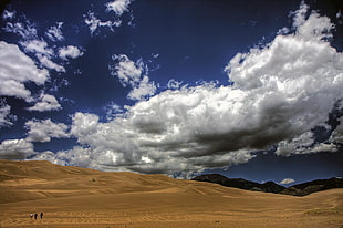 desert under white and blue cloudy sky during daytime, great sand dunes national park, colorado