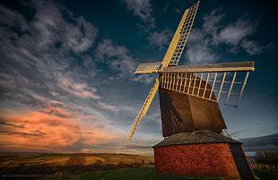 architectural photography of wind mill under stratus clouds, brill
