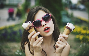 woman with pink sunglasses holding two ice creams on cone photo HD wallpaper