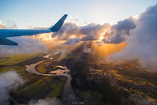body of water near buildings, passenger aircraft, airplane, clouds, aircraft HD wallpaper