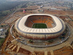 round gray and brown wooden table, stadium, Soccer CIty, Johannesburg, South Africa