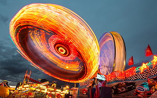 long exposure photography of carousel ride, long exposure, theme parks, lights, ferris wheel