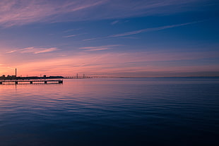 photography of river dock at dawn