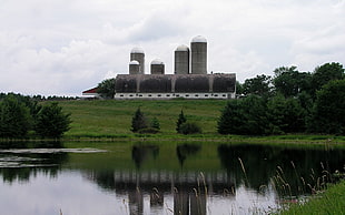 landscape photo of factory near green grass field