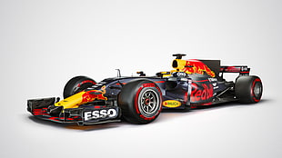 black, red, and yellow Formula 1 car