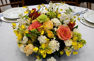 yellow, white, and red flowers decor