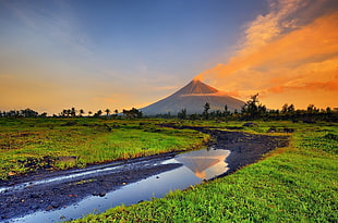 photo of perfect cone volcano during sunset