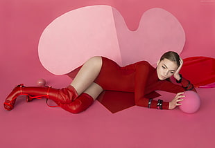 woman wearing red turtle-neck long-sleeved one-piece and red leather thigh-high boots