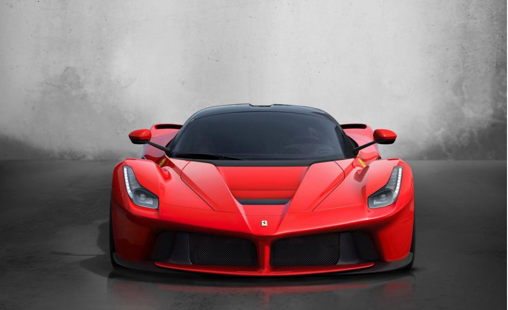 red and black Ferrari with gray background