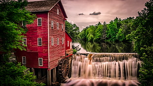 red concrete house near in waterfalls