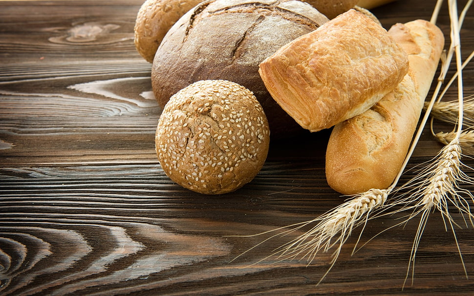 assorted breads on wooden surface HD wallpaper