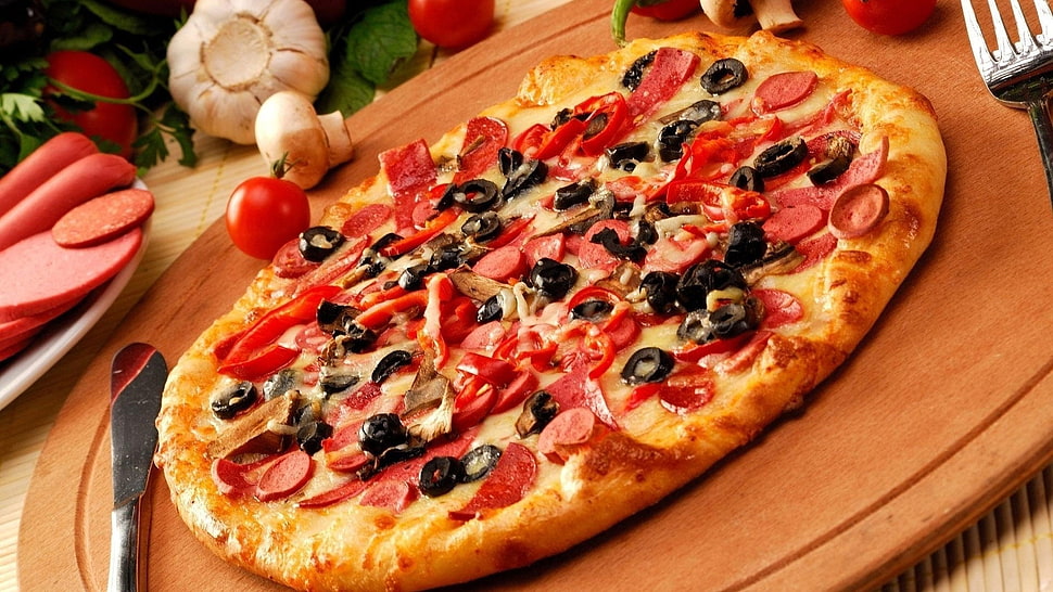 Pizza on brown wooden board HD wallpaper
