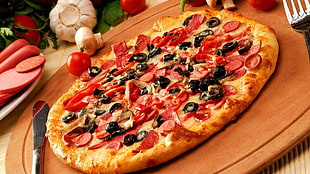 Pizza on brown wooden board