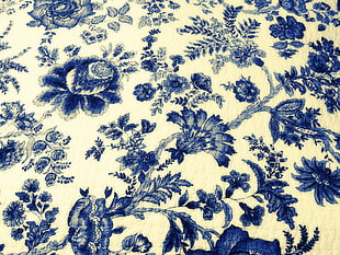 white and black floral textile