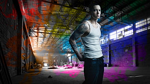 Eminem wearing white tank top and black pants