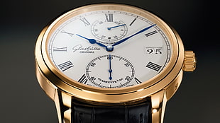 round gold frame chronograph watch
