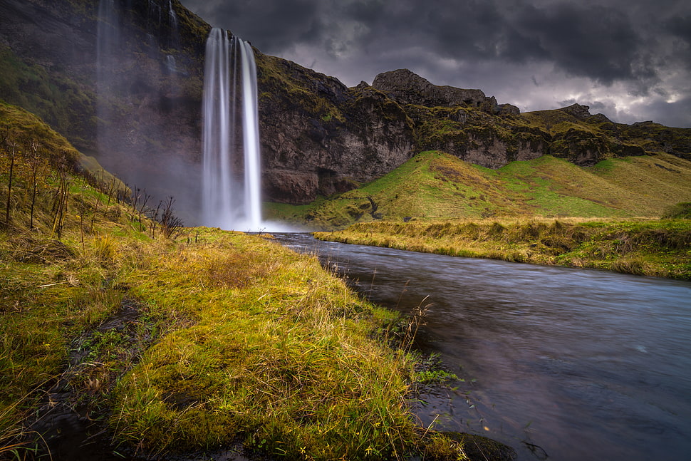 Waterfall above mountain lanscape photography HD wallpaper