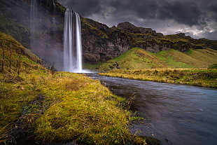 Waterfall above mountain lanscape photography