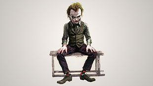 The Joker sitting on bench photo
