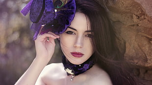 woman with purple mini hat
