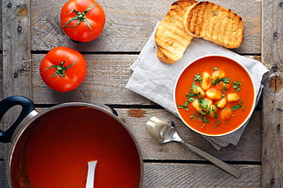 high angle photography of tomato sauce on ceramic bowl