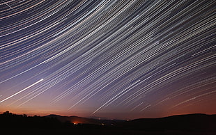 timelapse photography of shooting star during night time
