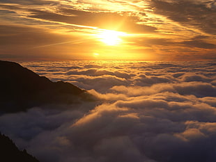 sea of clouds photo, sunset