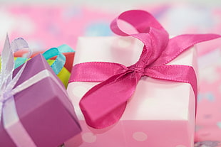 selective focus photography of pink and purple boxes