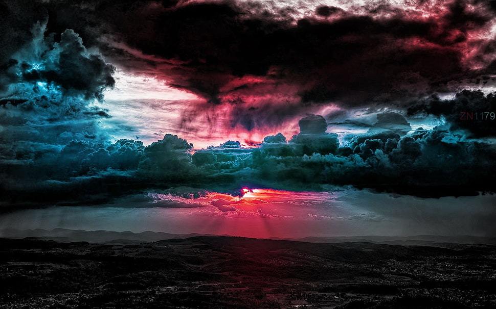field under bnlue and black clouds, clouds, sunset, lights, horizon HD wallpaper