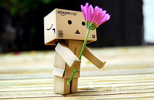 brown Amazon co jp robot holding pink flower