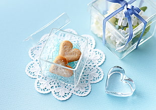 two heart biscuits on glass case