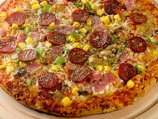 pizza with corn, cheese and hotdogs