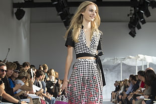 woman in black and white plaid print dress