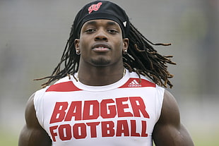 man wearing white and red Adidas Badger athletic shirt