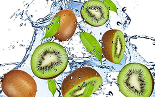 Kiwi fruit splashed with water